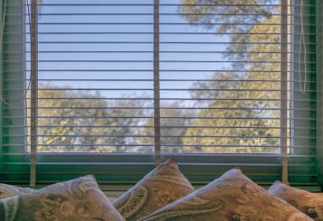 Mini blinds detail in a room, showcasing style and functionality.